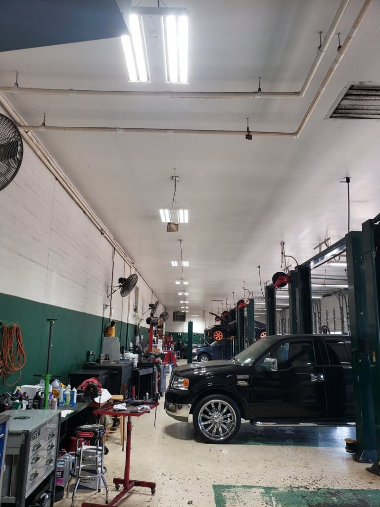 Commercial fluorescent lighting in an auto repair shop installed by Superior Electric and Lighting LLC in Southaven, MS