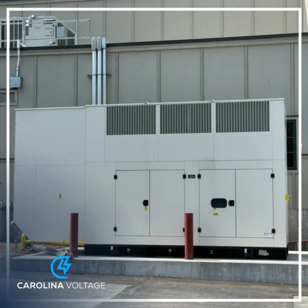 A large commercial backup generator unit installed outside a building by Carolina Voltage in Charlotte, NC.