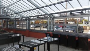 Interior view of a commercial space with multiple glass overhead doors installed by 314 Overhead Doors in O'Fallon, MO.