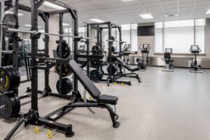 A commercial gym featuring durable rubber flooring installed by Capital Carpet & Flooring Specialists in Wilmington, MA