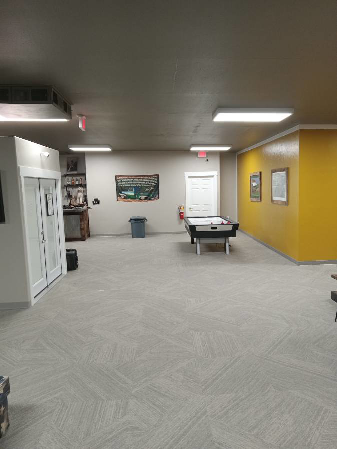Long commercial hallway featuring new carpet tile installation by Abbey Carpet and Flooring of Kalispell, MT