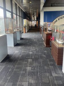 A commercial hallway featuring patterned carpet tiles installed by Carpet World Baton Rouge, LA.