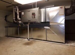 Commercial HVAC air handler unit with extensive ductwork installed by Central Heating & Air in Sioux Falls, SD