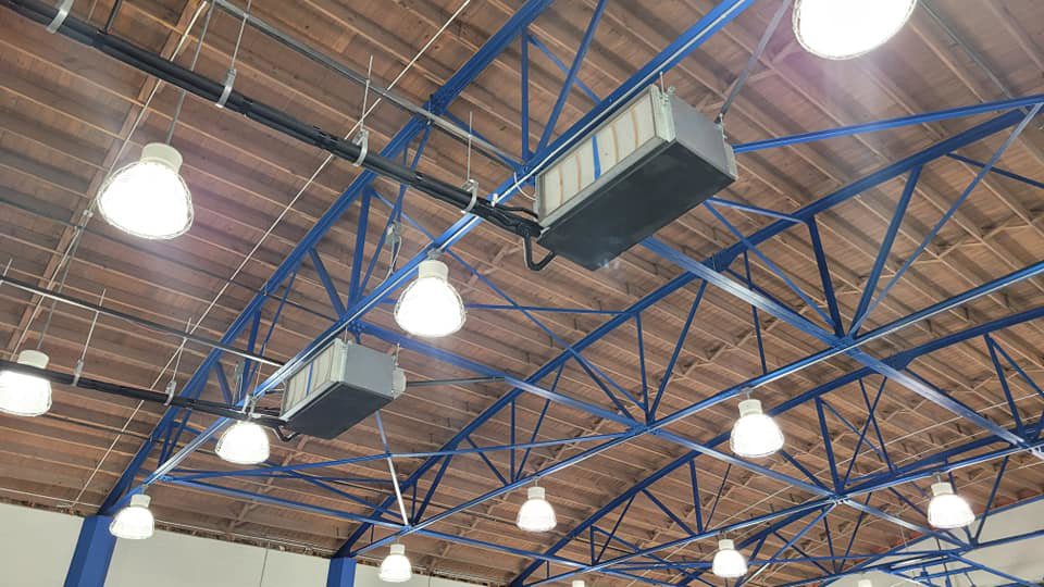 Commercial HVAC air handlers suspended from the ceiling in a building serviced by TEMCO of Gulf Coast Inc. in Biloxi, MS.