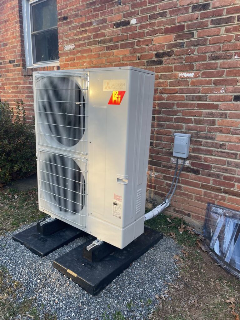 A large green pump and piping system for a commercial HVAC or boiler system by Mason Mechanical Services LLC HVAC Frederick Md in Jefferson, MD.