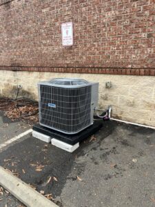 A commercial HVAC condenser unit installed in a parking lot area by On-Target Heating & Air LLC in Rock Hill, SC.