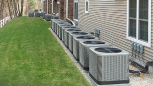 A row of commercial HVAC condenser units installed outside a building, representing services by Love HVAC LLC in Bluffton, SC.
