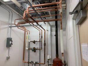 Intricate commercial HVAC copper piping system with valves installed by CM3, Inc. in Wichita, KS.