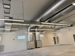 Commercial HVAC duct installation with large round and rectangular ducts by Buck'n Bull HVAC Solutions in Wilmington, NC
