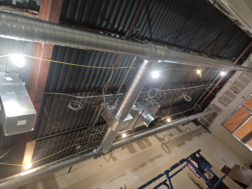 Detailed view of a commercial HVAC duct system installed by Acclimated Air LLC in Virginia Beach, VA.