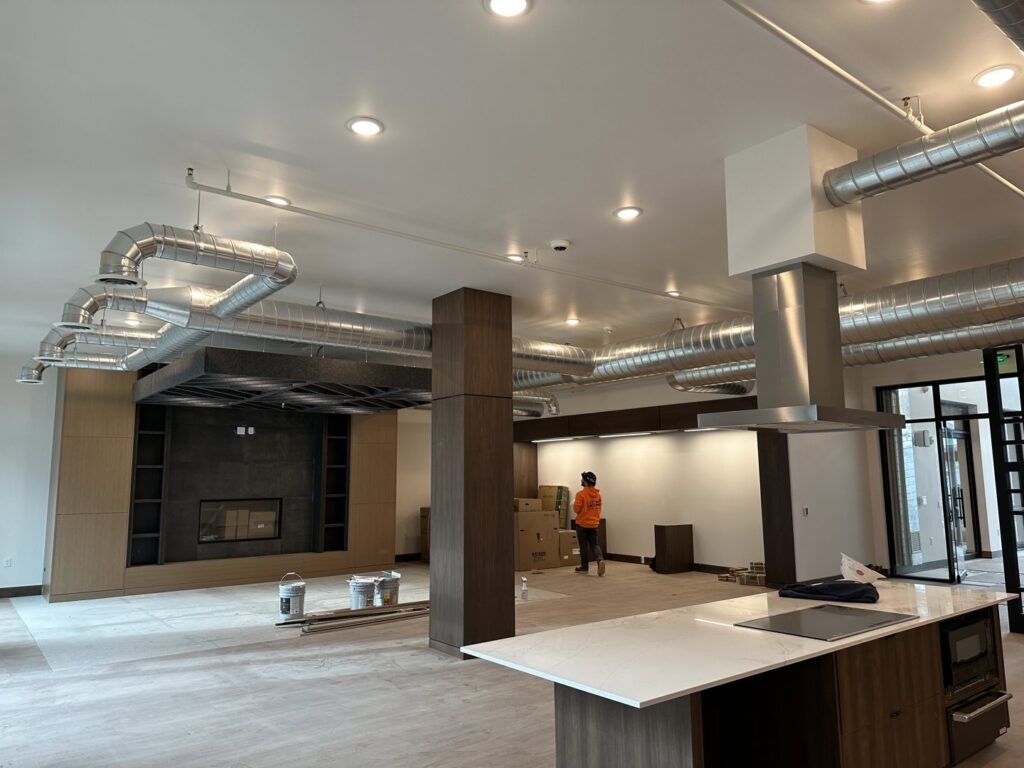 Commercial HVAC ductwork and ventilation system installed in a large room by Cutting Edge HVAC LLC in Orem, UT.