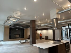 Commercial HVAC ductwork and ventilation system installed in a large room by Cutting Edge HVAC LLC in Orem, UT.