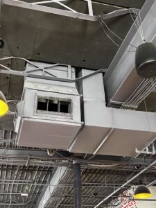 Commercial HVAC ductwork and vents installed on a ceiling by STAR Heating Cooling Plumbing in Fishers, IN.