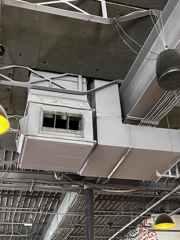 Commercial HVAC ductwork and vents installed on a ceiling by STAR Heating Cooling Plumbing in Fishers, IN.