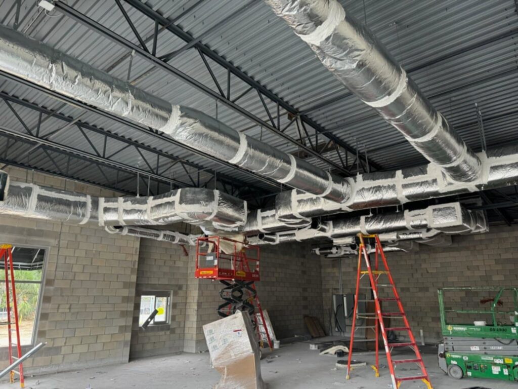 Commercial HVAC ductwork installation in a building under construction by Huggins Mechanical in Jacksonville, FL