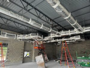 Commercial HVAC ductwork installation in a building under construction by Huggins Mechanical in Jacksonville, FL