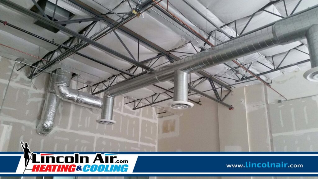 New commercial HVAC ductwork installation visible in a building under construction by Lincoln Air & Plumbing in Phoenix, AZ