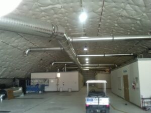 Large commercial HVAC ductwork installed in a warehouse by Raytech Refrigeration, Heating & Cooling in Alamogordo, NM.
