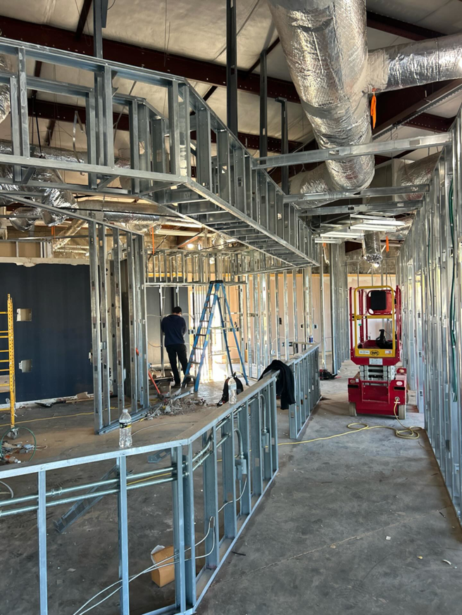 New HVAC ductwork being installed in a commercial building under construction by Scout Mechanical in Greenville, SC.