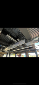 New commercial HVAC ductwork installed in a building with an exposed ceiling by WV Heating and Air in Morgantown, WV