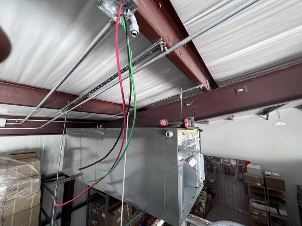 Commercial HVAC electrical conduit and wiring installation on a ceiling, performed by Quistian Lighting in Arlington, TX