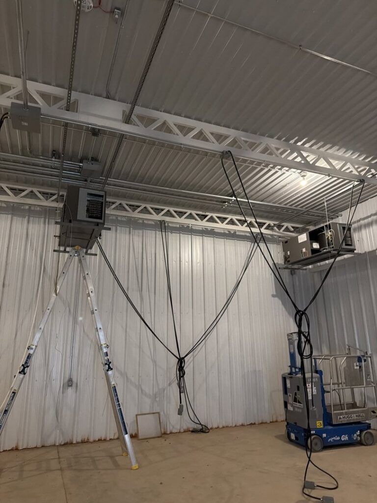 Commercial HVAC units being installed or serviced in a large building by Oklahoma Climate Solutions in Oklahoma City, OK.