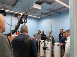 Commercial HVAC mechanical room equipment including pipes and tanks at Buckley Associates, Inc. in Hanover, MA