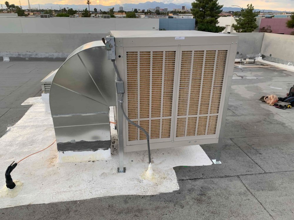 A large commercial HVAC rooftop unit with extensive ductwork installed by Instant Air in Las Vegas, NV.