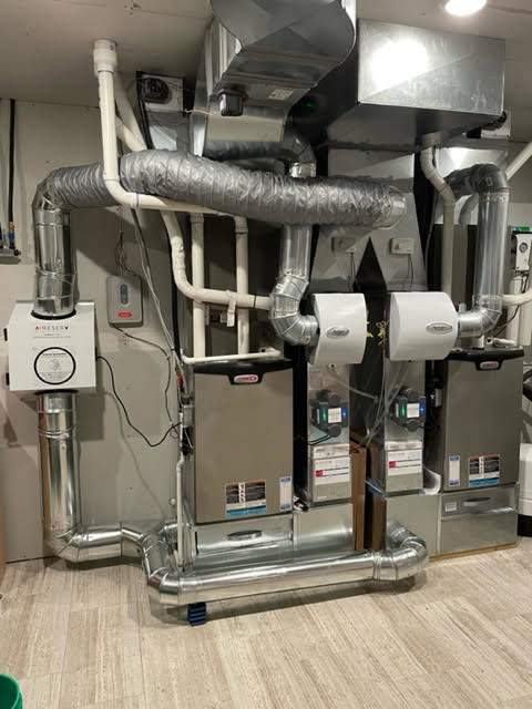 A complex commercial HVAC system installation with multiple units and ductwork by Aire Serv of Fargo, ND.