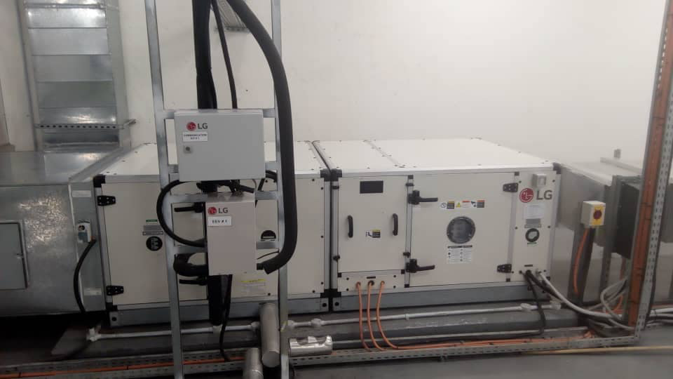 Large commercial LG HVAC units with ductwork and control boxes, installed by Facilityfix technicians in Port Harcourt, NG.
