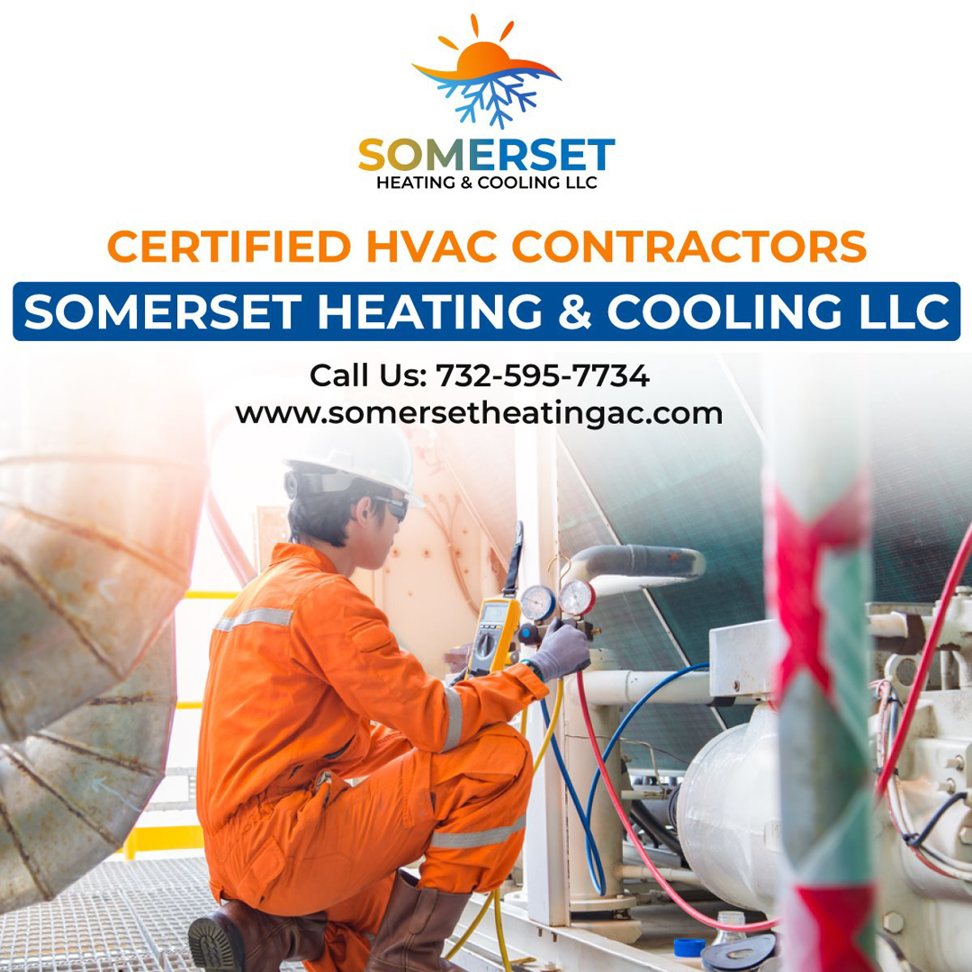 A commercial HVAC technician working on a large system with gauges for Somerset Heating & Cooling LLC in Somerset, NJ.