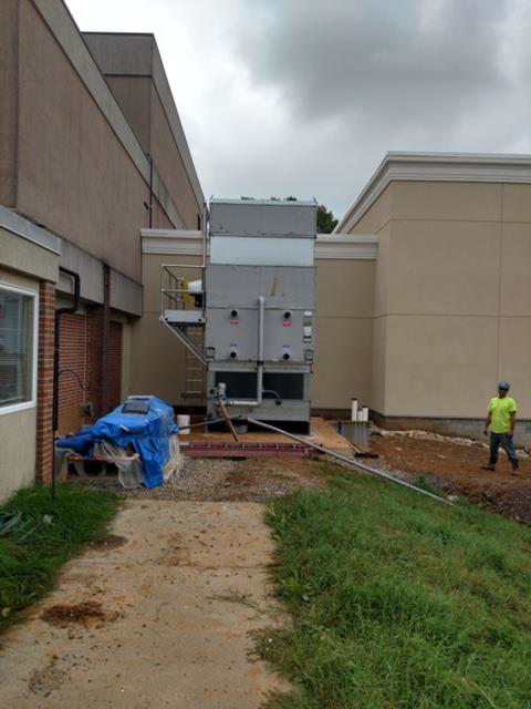 A large commercial HVAC unit being installed or serviced outside a building by EH Gochnauer & Sons, Inc. in Lancaster, PA.