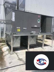 A large commercial HVAC unit installed on a platform by TC A/C & Refrigeration in Lafayette, LA