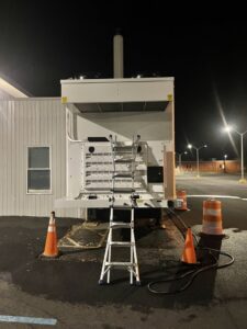 A large commercial HVAC unit on site with a ladder, ready for service by Best Plumbing Heating & Cooling Contractors in Albany, NY.