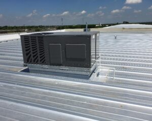 A large commercial HVAC unit installed on a rooftop by Premier Comfort Service Company in San Antonio, TX.