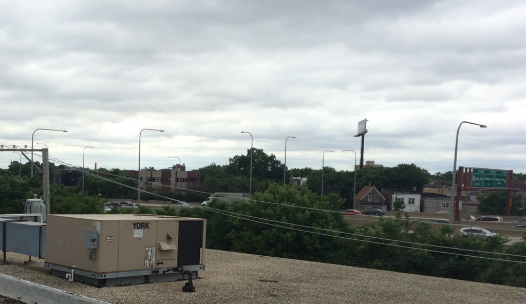 A large commercial YORK HVAC unit on a rooftop, serviced by Corbe Heating and Air Conditioning in Elgin, IL.