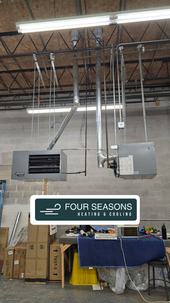 Two commercial HVAC units and associated ductwork installed in a large building by Four Seasons HVAC in Murfreesboro, TN.