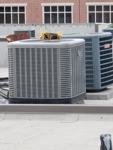 Commercial HVAC condenser units installed on a rooftop by Henson's HVAC LLC in Rock Hill, SC.