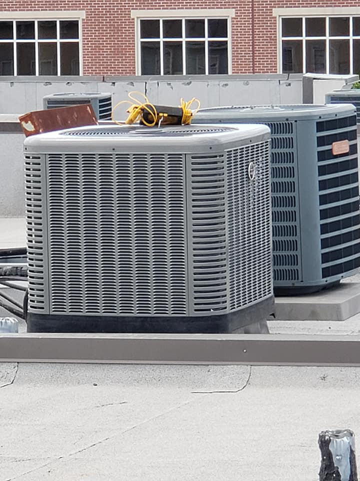 Commercial HVAC condenser units installed on a rooftop by Henson's HVAC LLC in Rock Hill, SC.