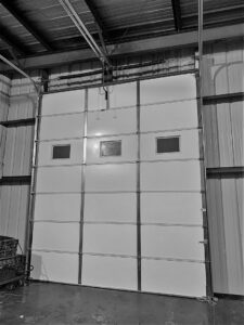 A large commercial or industrial garage door installed by Tulsa Garage Door Doctor LLC in Tulsa, OK