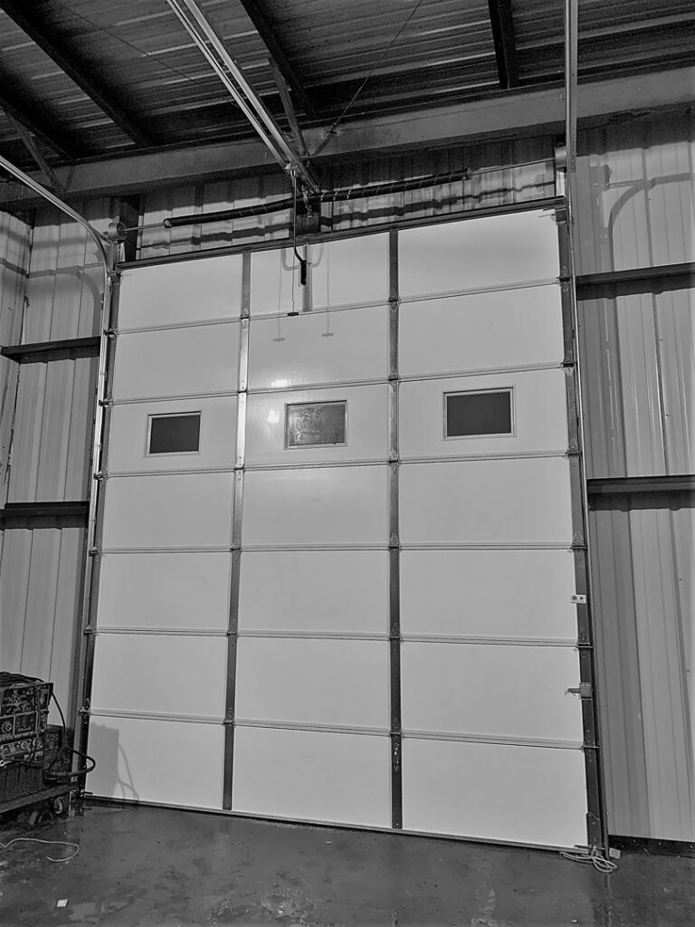A large commercial or industrial garage door installed by Tulsa Garage Door Doctor LLC in Tulsa, OK