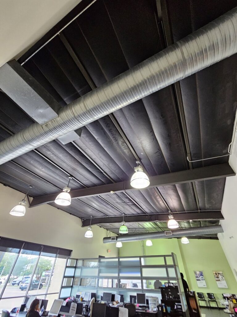 Modern commercial interior lighting and exposed ductwork installed by Apex Electric LLC in Brea, CA.