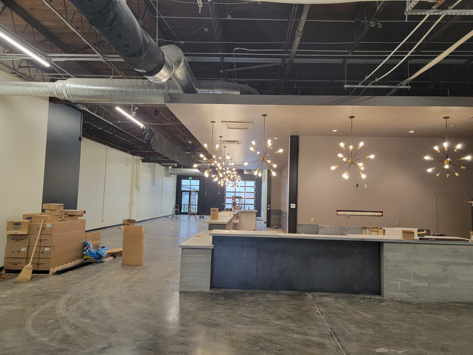 Wide view of a commercial interior with new lighting fixtures installed by Trouble Shooters Electric Inc. in Pell City, AL