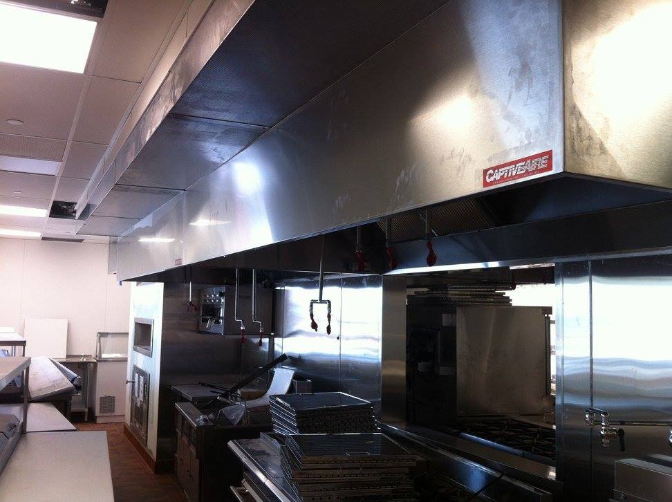 A large commercial kitchen exhaust hood system installed by 1st Team Air Conditioning in Anaheim, CA