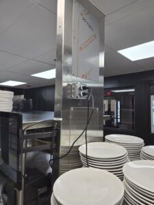 Commercial electrical outlets installed on a stainless steel column in a kitchen by ILIC Electric in Chicago, IL.