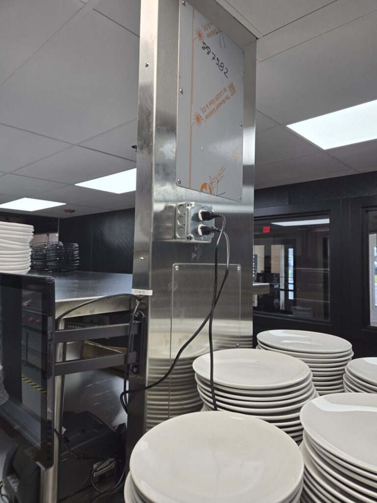 Commercial electrical outlets installed on a stainless steel column in a kitchen by ILIC Electric in Chicago, IL.