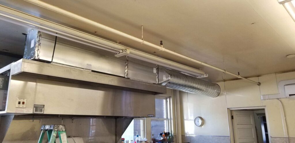 Commercial kitchen ventilation system with exhaust hood and ductwork by Maddog Contracting LLC in Post Falls, ID.