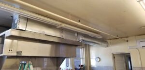 Commercial kitchen ventilation system with exhaust hood and ductwork by Maddog Contracting LLC in Post Falls, ID.