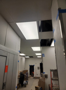 Commercial LED ceiling light panel installation in a modern interior by BESTA in Perkasie, PA.