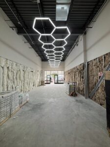 Commercial LED hexagonal lighting installation in a new building by Wilson Electrical Contractors in Orlando, FL.
